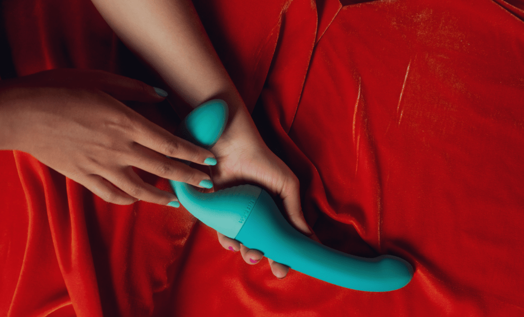 Banana Split Shop's sapphic and lesbian partner vibrator, The Split being held by a sapphic couple. 