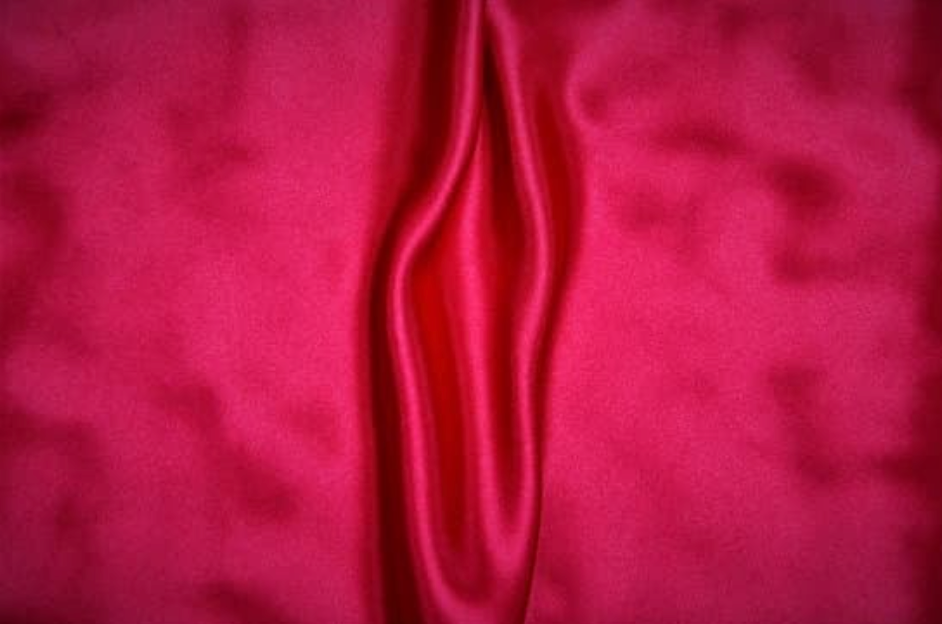 Image of sheets scrunched up in the shape of a vulva