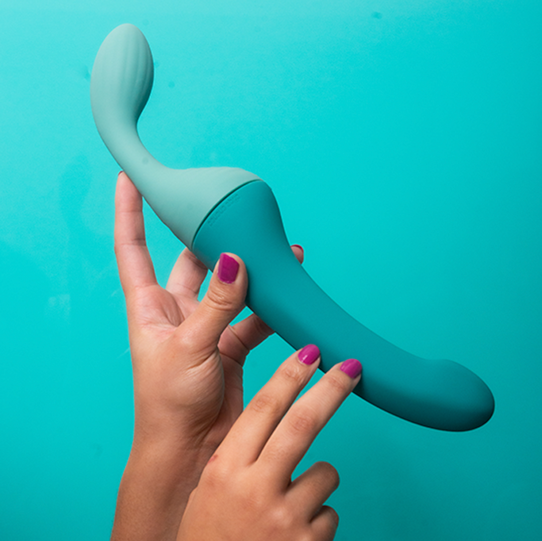 Image of the Split partner vibrator being held up against a blue background.