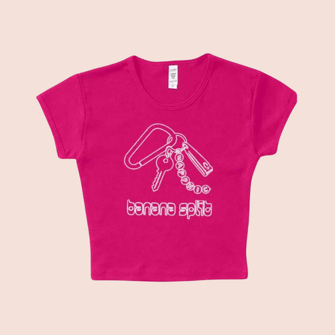 Banana Split Tee in pink with white graphic of a carabiner holding keys, nail clippers, and a keychain that says "sapphic."