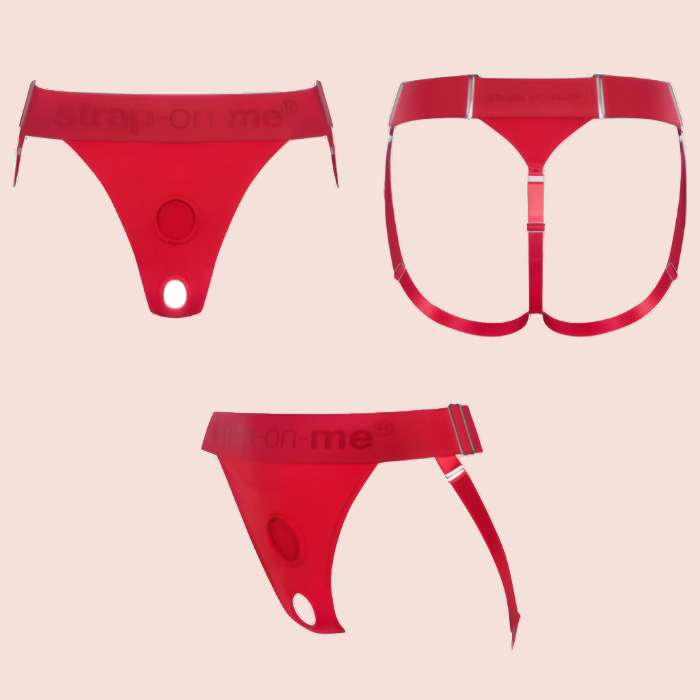 The red Strap-on-me Lingerie Harness in three orientations, one from the back one from the side, one from the front. 