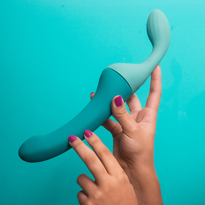 Photograph of the Split blue and mint modular partner vibrator set composed of one Dollop vibrator and one Banana vibrator.